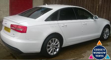 Audi A6 with Limo black window tints on rear windows.  The limo black creates great contrast when installed against white. Eddie's Window Tints Wishaw 01698 640697