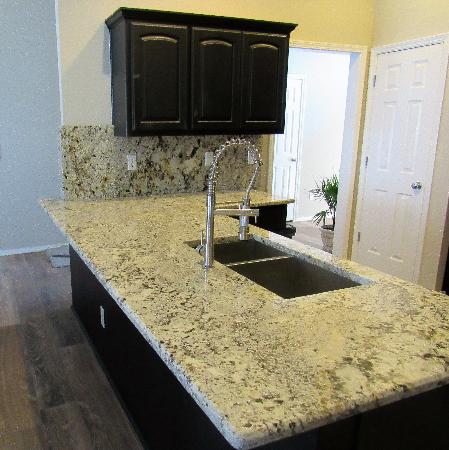 Custom Kitchen with Full Granite Back Splash in Alaska White and Beveled Edges. Red River Granite Importers Oklahoma City (580)595-0564