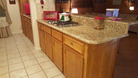 Custom Cooking Area with full Back Splash and Bar Top, in Giallo Ornamental Granite Red River Granite Importers Oklahoma City (580)595-0564