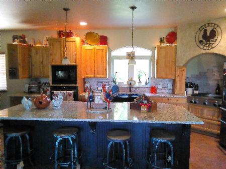 Custom Kitchen in Santa Cecilia Granite with Chiseled Edges. Red River Granite Importers Oklahoma City (580)595-0564