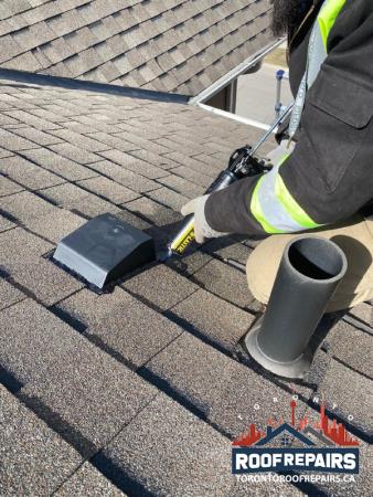 exhaust roof vent installation on the shingle roof and sealing around it with new roof sealant. Toronto Roof Repairs Inc | Roofing Company | Shingle Roof Repair | Roof Replacement Mississauga (416)247-2769