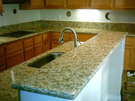 Granite kitchen with raised island counter. Performance Construction & Remodeling Inc. Chino Hills (714)655-6427