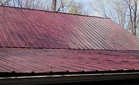 Red metal roof replacement finished product. Burnsville, NC Jlc Service Group Candler (828)209-7455