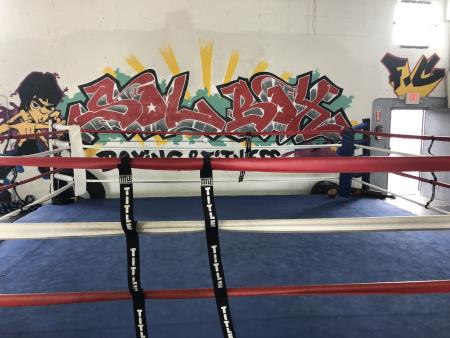 Our Boxing Ring with our logo painted in a graffiti style. SolBox Fitness Club Miami (305)759-7685