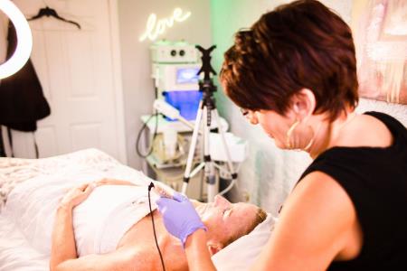 diana j rieger lc, clt performing mesotherapy microneedling.  Love Skin Holistic Medical Spa Tempe (480)378-6203